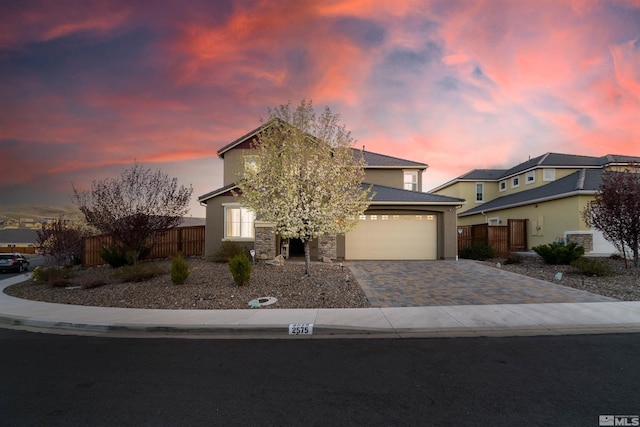 2575 Piero Ct, Sparks, NV 89434 - view of front of property featuring fence, driveway, a garage, and stone siding