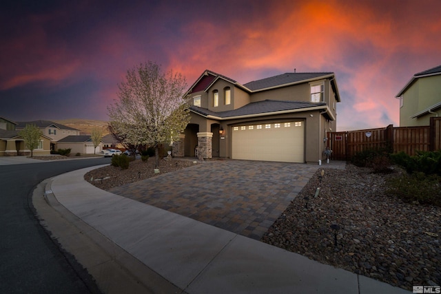 2575 Piero Ct, Sparks, NV 89434 - view of front of property featuring decorative driveway, stucco siding, fence, a tile roof, and an attached garage