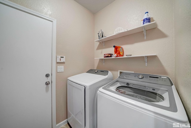 166 Oakridge Dr, Dayton, NV 89403 - washroom featuring washer and clothes dryer and a textured wall