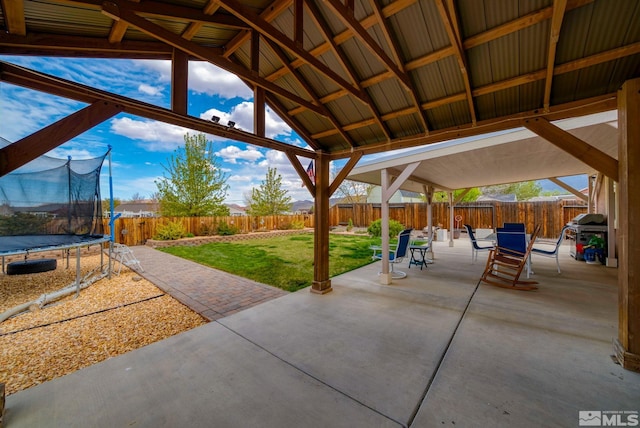 166 Oakridge Dr, Dayton, NV 89403 - view of patio / terrace featuring a trampoline, outdoor dining space, and a grill