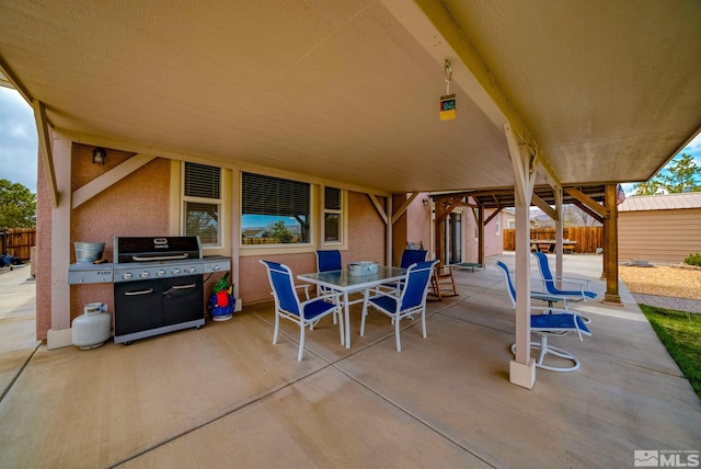 166 Oakridge Dr, Dayton, NV 89403 - view of patio with fence, outdoor dining space, and a grill