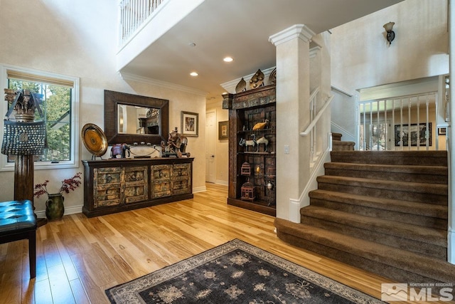 2143 The Back Rd, Glenbrook, NV 89413 - stairs featuring wood finished floors, baseboards, crown molding, and recessed lighting