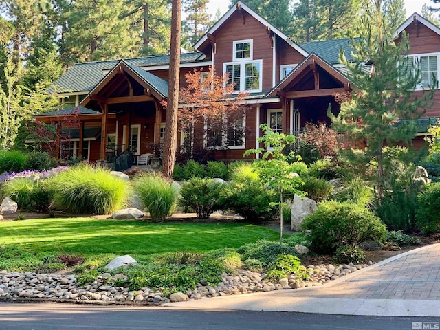 2143 The Back Rd, Glenbrook, NV 89413 - view of front of house featuring a front lawn, a porch, and metal roof