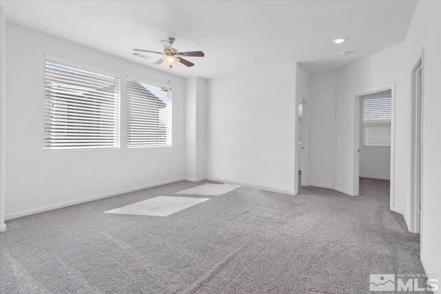 6742 Peppergrass Dr, Sparks, NV 89436 - unfurnished bedroom featuring carpet floors, multiple windows, and baseboards