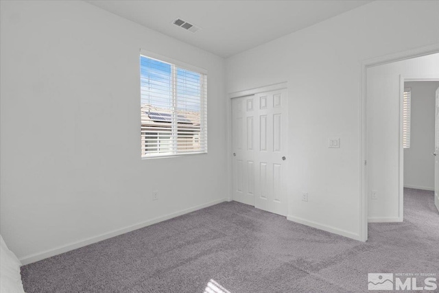 6742 Peppergrass Dr, Sparks, NV 89436 - unfurnished bedroom featuring carpet flooring, baseboards, and a closet