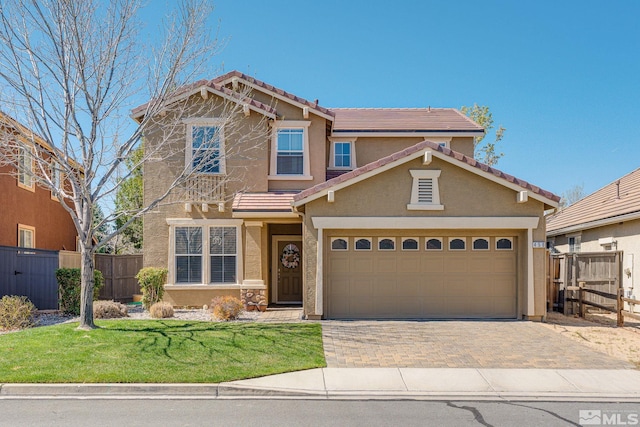 450 Ruffian Ct, Reno, NV 89521 - view of front of home featuring stucco siding, a tile roof, decorative driveway, and a garage