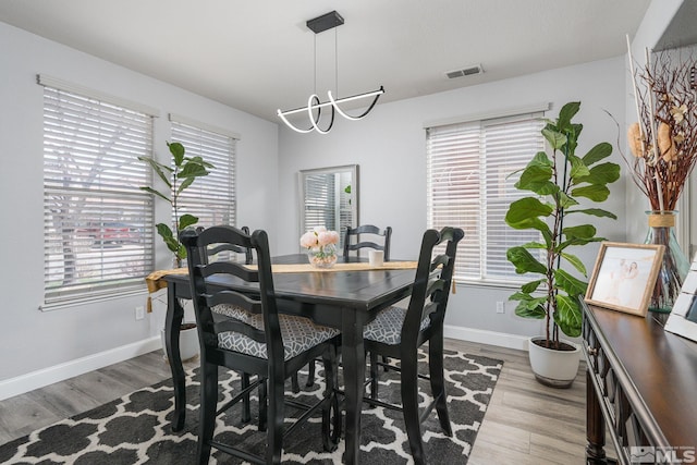 450 Ruffian Ct, Reno, NV 89521 - dining space with wood finished floors, baseboards, and a chandelier