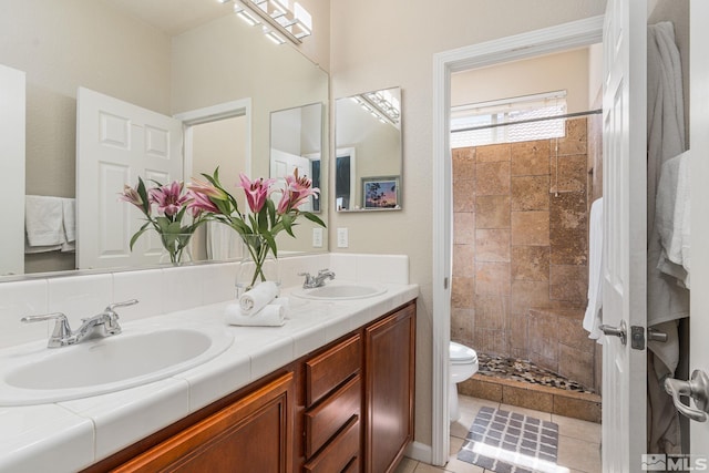 450 Ruffian Ct, Reno, NV 89521 - full bathroom featuring toilet, tiled shower, and double vanity