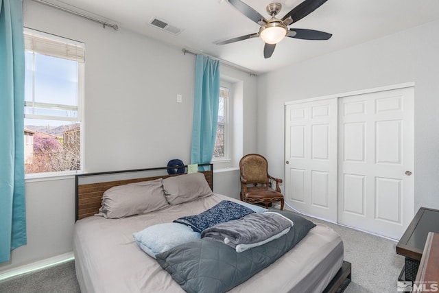 450 Ruffian Ct, Reno, NV 89521 - carpeted bedroom featuring multiple windows, a closet, and ceiling fan