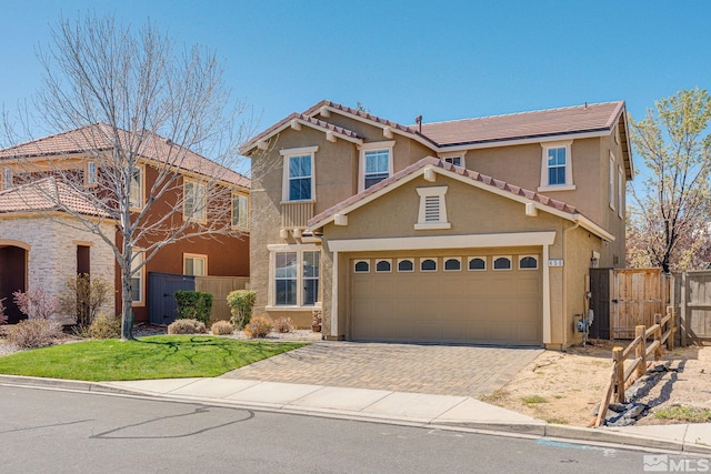 450 Ruffian Ct, Reno, NV 89521 - view of front of house with fence, stucco siding, decorative driveway, a tiled roof, and a garage