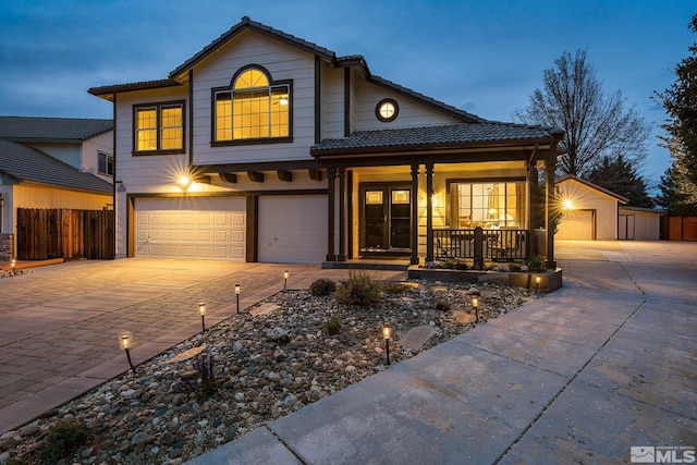 2116 Frisco Way, Sparks, NV 89434 - traditional-style home with a tiled roof, concrete driveway, a porch, a garage, and fence