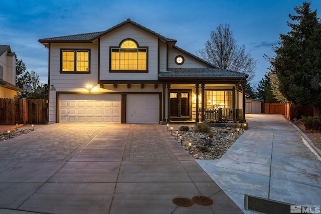 2116 Frisco Way, Sparks, NV 89434 - traditional-style home with a porch, a garage, fence, driveway, and a tile roof