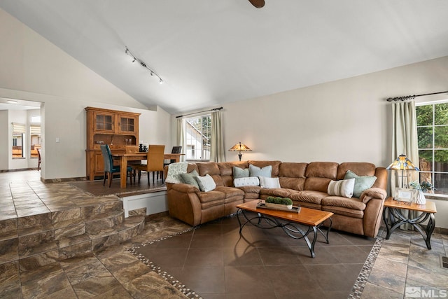 2116 Frisco Way, Sparks, NV 89434 - living area featuring track lighting, high vaulted ceiling, and baseboards