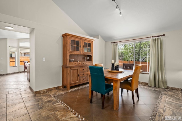 2116 Frisco Way, Sparks, NV 89434 - dining area featuring baseboards, lofted ceiling, track lighting, and inlaid floor details