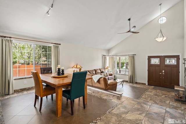 2116 Frisco Way, Sparks, NV 89434 - dining room featuring high vaulted ceiling, baseboards, rail lighting, and ceiling fan