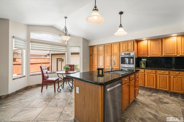 2116 Frisco Way, Sparks, NV 89434 - kitchen featuring stainless steel appliances, a sink, lofted ceiling, healthy amount of natural light, and brown cabinets