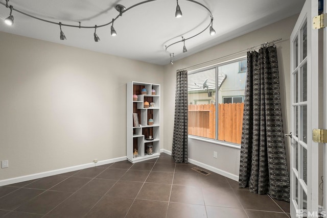 2116 Frisco Way, Sparks, NV 89434 - unfurnished dining area with tile patterned floors and baseboards