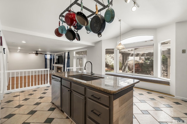 960 Country Ridge Dr, Sparks, NV 89434 - kitchen featuring a sink, dishwasher, vaulted ceiling, dark stone countertops, and pendant lighting