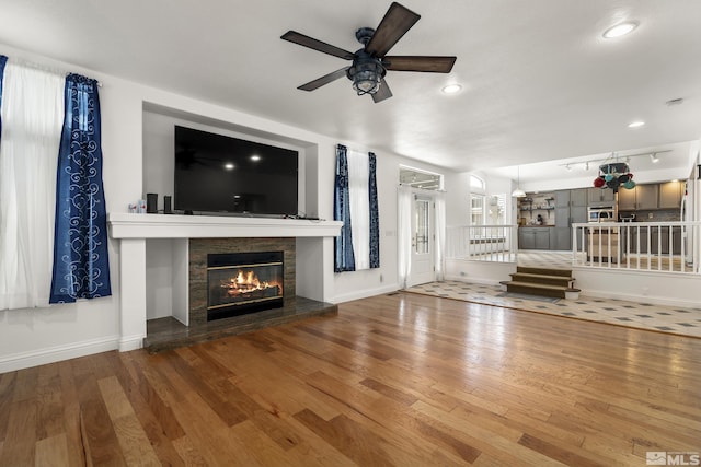 960 Country Ridge Dr, Sparks, NV 89434 - unfurnished living room with a ceiling fan, hardwood / wood-style floors, a fireplace, baseboards, and recessed lighting