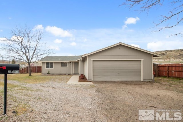 68 Zircon Dr, Reno, NV 89521 - ranch-style home featuring driveway, an attached garage, and fence