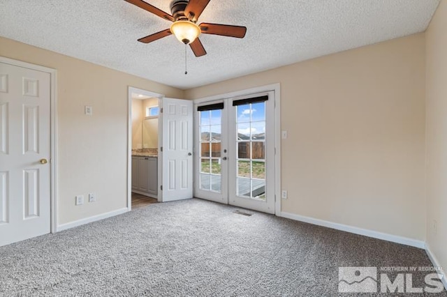 68 Zircon Dr, Reno, NV 89521 - unfurnished bedroom featuring access to outside, carpet floors, baseboards, french doors, and a textured ceiling