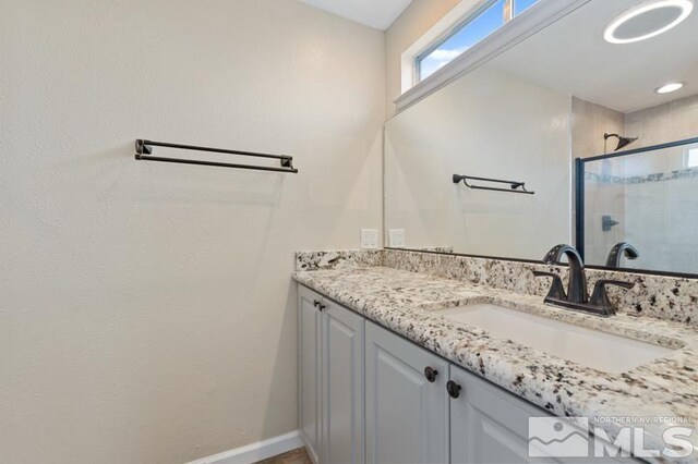 68 Zircon Dr, Reno, NV 89521 - full bath with a shower stall, vanity, and baseboards