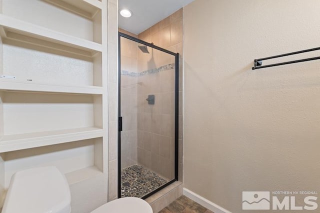 68 Zircon Dr, Reno, NV 89521 - bathroom with toilet, a shower stall, and baseboards