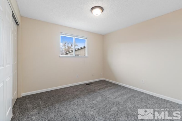 68 Zircon Dr, Reno, NV 89521 - unfurnished bedroom featuring carpet flooring, a textured ceiling, a closet, and baseboards