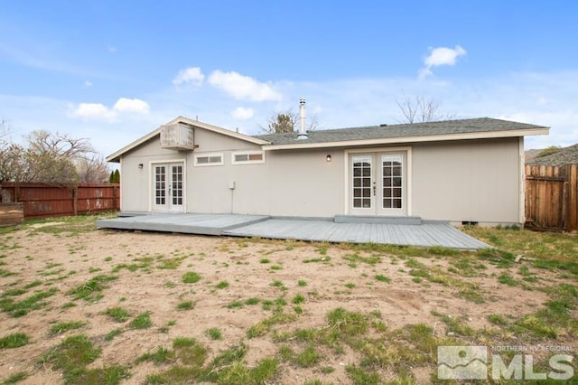 68 Zircon Dr, Reno, NV 89521 - rear view of property featuring french doors, a wooden deck, and fence