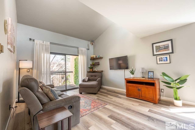 2700 Plumas St Unit 300, Reno, NV 89509 - living area featuring light wood-style flooring, lofted ceiling, and baseboards