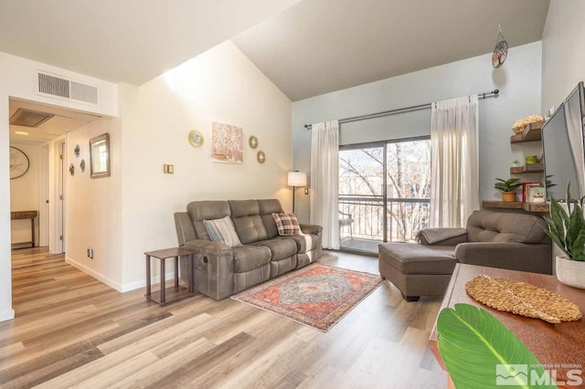 2700 Plumas St Unit 300, Reno, NV 89509 - living room featuring light wood-style flooring, lofted ceiling, and baseboards