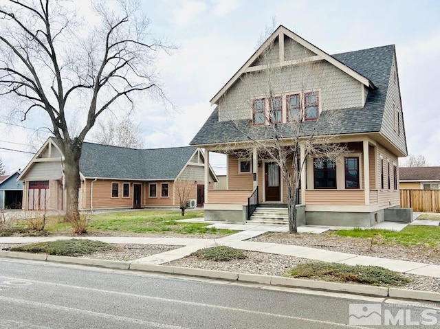 215 S Broad St, Battle Mountain, NV 89820 - view of front of house featuring covered porch and roof with shingles