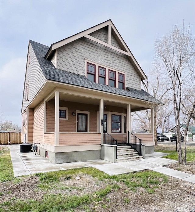 215 S Broad St, Battle Mountain, NV 89820 - view of front facade with a shingled roof, fence, and a porch