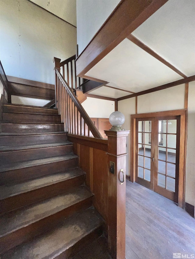 215 S Broad St, Battle Mountain, NV 89820 - staircase featuring wood finished floors and french doors