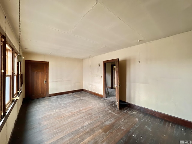215 S Broad St, Battle Mountain, NV 89820 - unfurnished room with baseboards and hardwood / wood-style floors