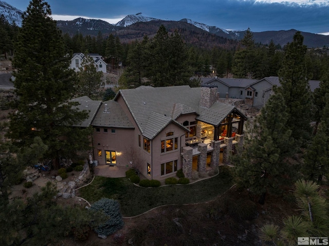 4660 W Pinewild Rd, Reno, NV 89511 - aerial view of property and surrounding area with mountains and a forest