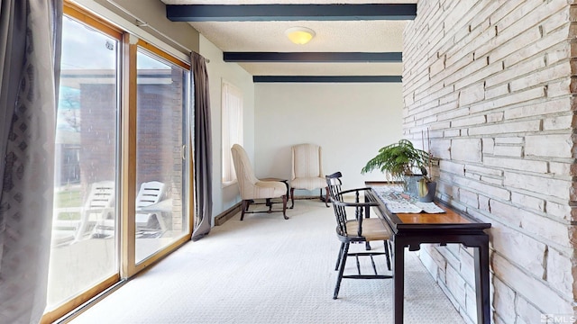 sunroom with beamed ceiling