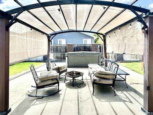 view of patio / terrace featuring a hot tub, a fire pit, a fenced backyard, and a pergola