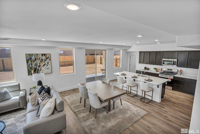 15 Nova Ct Unit 112, Carson City, NV 89705 - dining area featuring light wood-style floors, recessed lighting, and baseboards