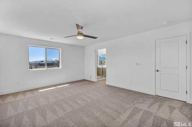 15 Nova Ct Unit 112, Carson City, NV 89705 - spare room with plenty of natural light, ceiling fan, carpet flooring, and baseboards