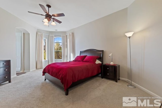 9900 Wilbur May Pkwy Unit 2704, Reno, NV 89521 - bedroom with carpet flooring, baseboards, arched walkways, and ceiling fan