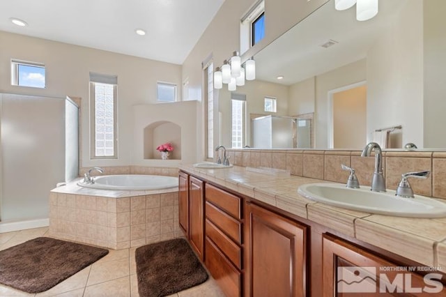 9900 Wilbur May Pkwy Unit 2704, Reno, NV 89521 - full bathroom featuring a shower stall, a bath, tile patterned floors, and double vanity