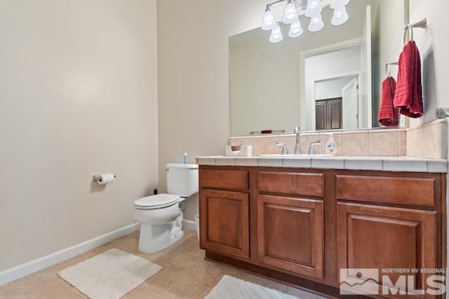 9900 Wilbur May Pkwy Unit 2704, Reno, NV 89521 - bathroom featuring a chandelier, toilet, tile patterned floors, vanity, and baseboards