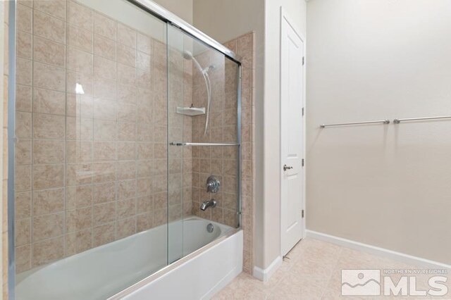 9900 Wilbur May Pkwy Unit 2704, Reno, NV 89521 - full bath with combined bath / shower with glass door, tile patterned flooring, and baseboards