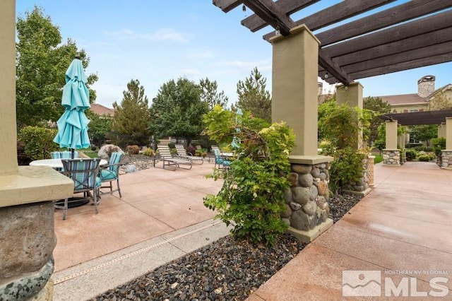 9900 Wilbur May Pkwy Unit 2704, Reno, NV 89521 - view of patio / terrace with a pergola and outdoor dining space