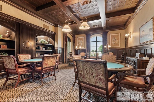 9900 Wilbur May Pkwy Unit 2704, Reno, NV 89521 - carpeted dining area featuring coffered ceiling, beamed ceiling, crown molding, a wainscoted wall, and a decorative wall