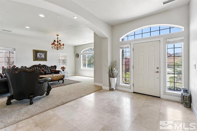 134 Denio, Dayton, NV 89403 - foyer entrance featuring light colored carpet, a chandelier, arched walkways, baseboards, and recessed lighting