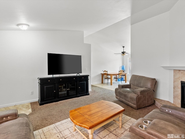 1564 Reese River Rd, Fernley, NV 89408 - carpeted living area with a fireplace, a ceiling fan, and vaulted ceiling