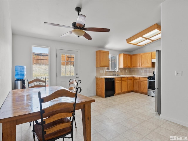 1564 Reese River Rd, Fernley, NV 89408 - kitchen with black dishwasher, stainless steel range with gas cooktop, a sink, light countertops, and backsplash