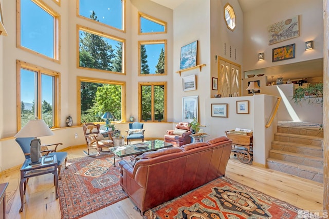 180 Nottingham Ct, Reno, NV 89511 - living room with a high ceiling, hardwood / wood-style flooring, and stairway